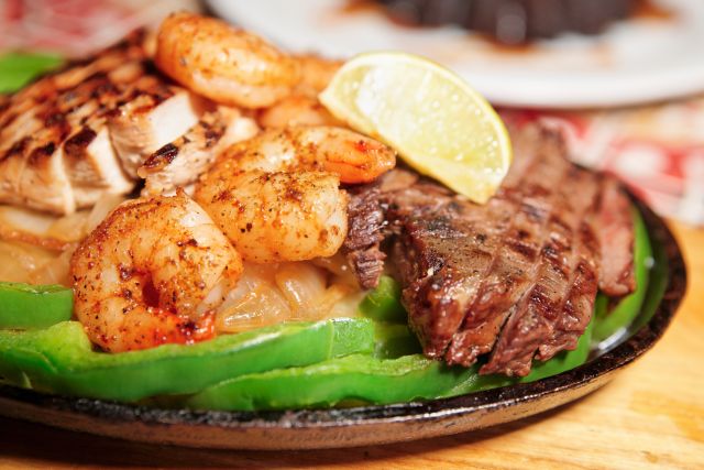 Fajitas with shrimp, chicken, and beef